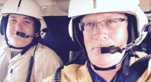 Photo of regional field manager and fire management officer in helicopter.