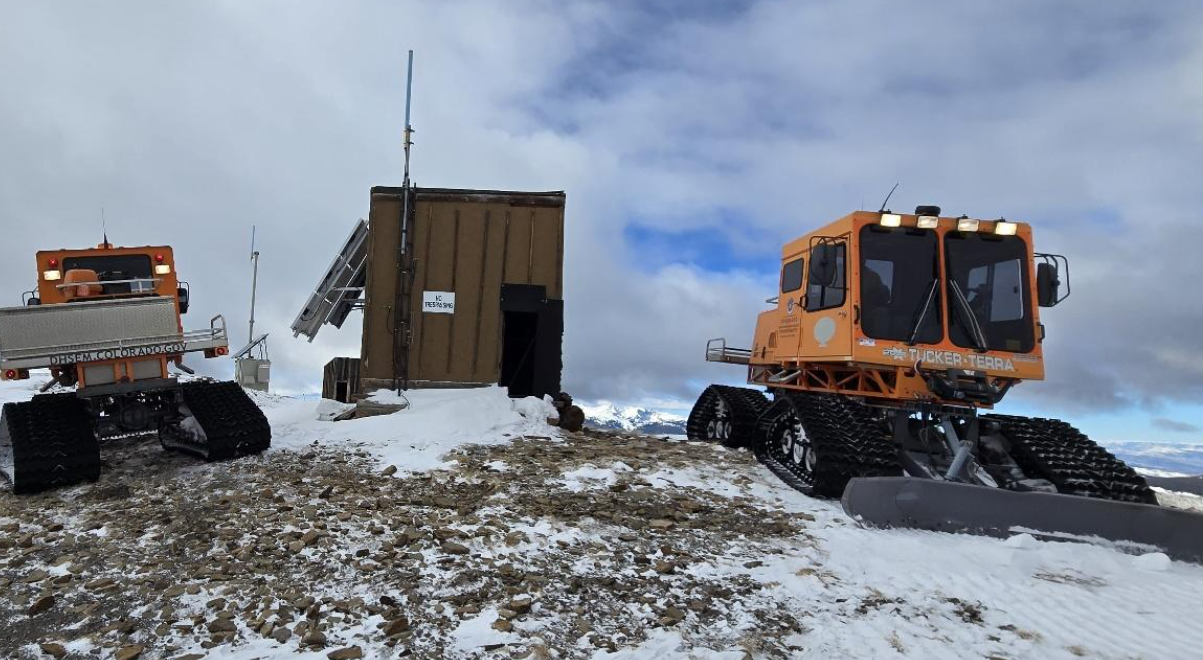 Snowcats awaiting their cargo.